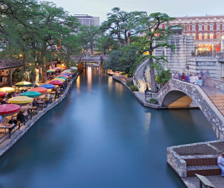 San Antonio River Walk in Texas with trees and customers.